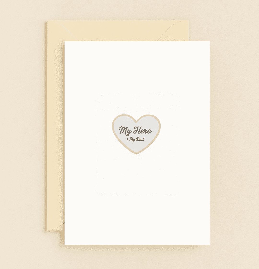 Celebrate Father's Day with a simple yet heartfelt card featuring a touching "My Hero + My Dad" message inside a gray heart, perfect for honoring your hero.