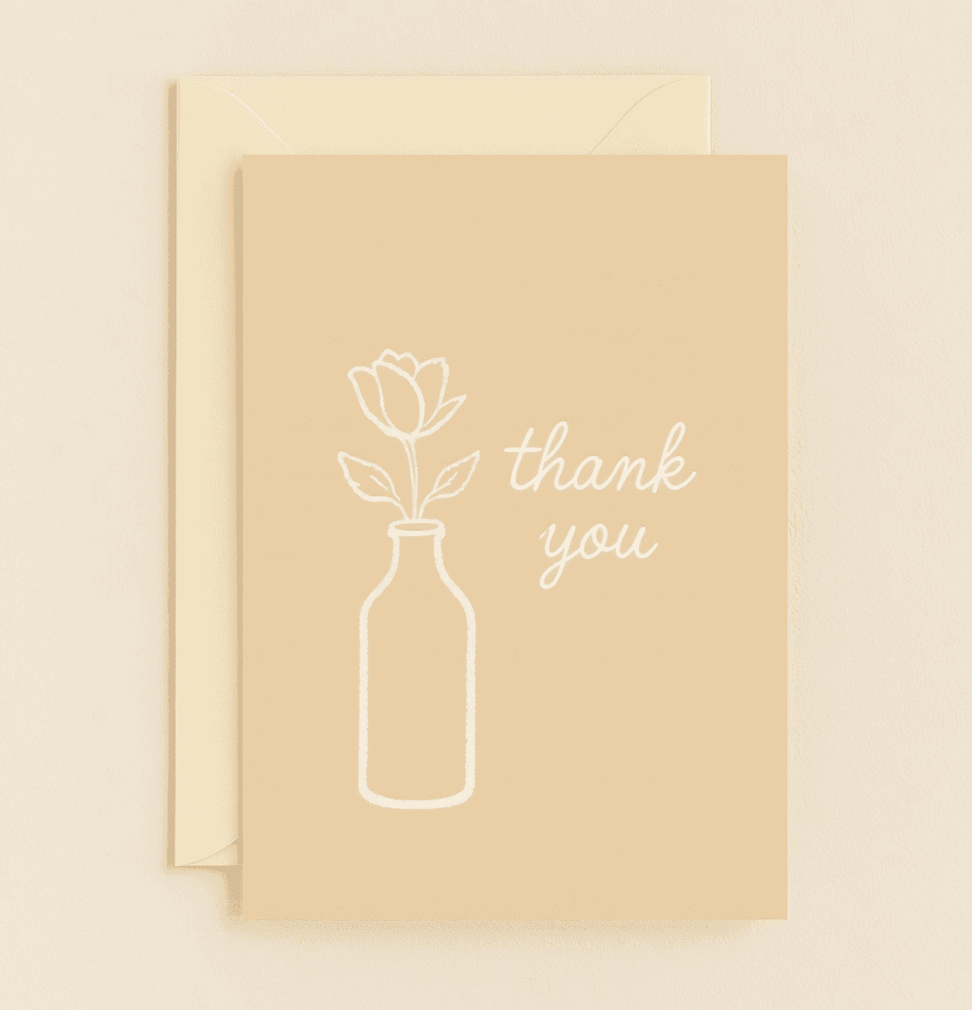 Express heartfelt thanks with this minimalist greeting card, featuring an elegant white flower in a vase on a light brown background.
