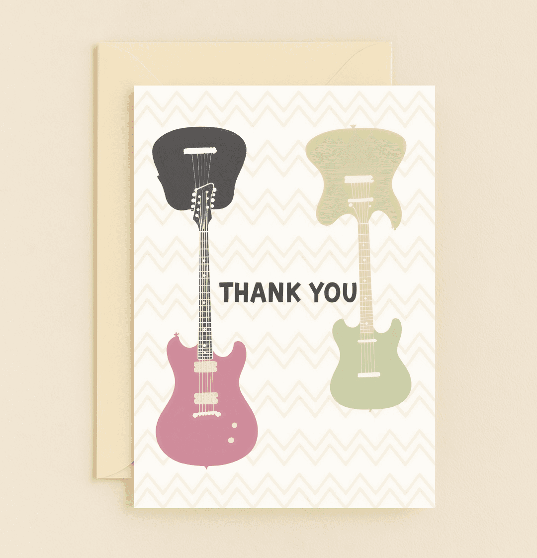 Express your gratitude with a musical twist through this vibrant card featuring balloon-like electric guitars and playful wordplay.