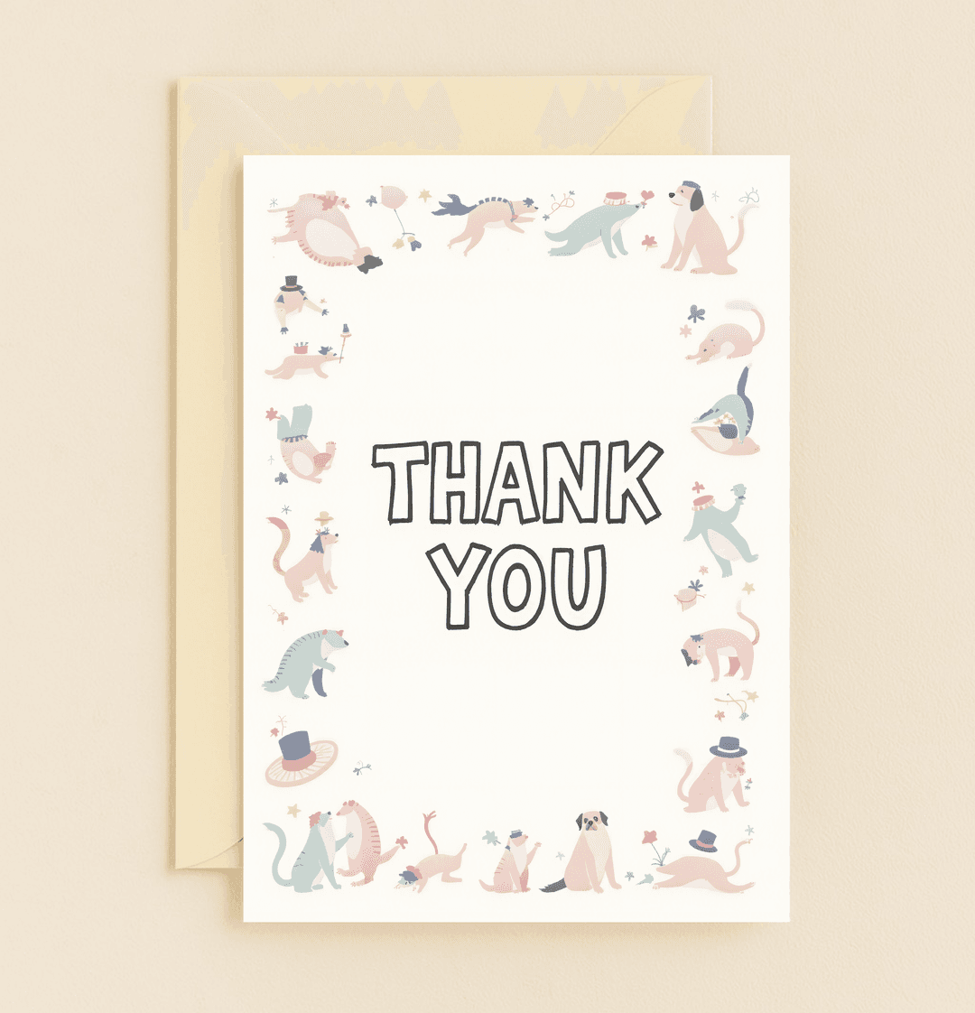 Express gratitude with "Paws and Play: A Grateful Display," a whimsical thank you card featuring playful dogs in hats and flowers for a lighthearted touch.