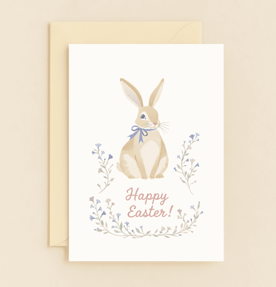 Celebrate Easter with a charming card featuring a ribbon-adorned bunny amid pastel blooms, spreading joy and warmth with a heartfelt "Happy Easter!.