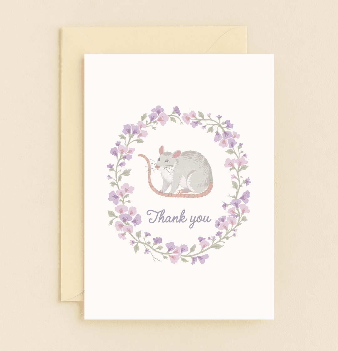 Delight in whimsical charm with a cute mouse nestled in a pastel floral wreath, elegantly expressing your gratitude with a touch of whimsy.