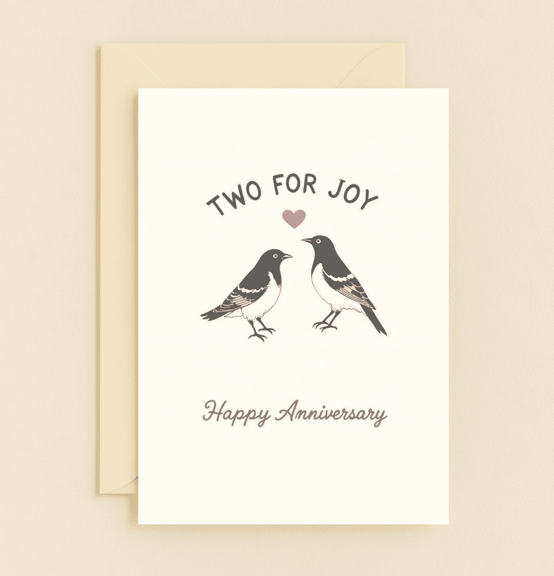 Celebrate your love with this charming anniversary card featuring playful magpies, a heart, and delightful wordplay: "Two for Joy.