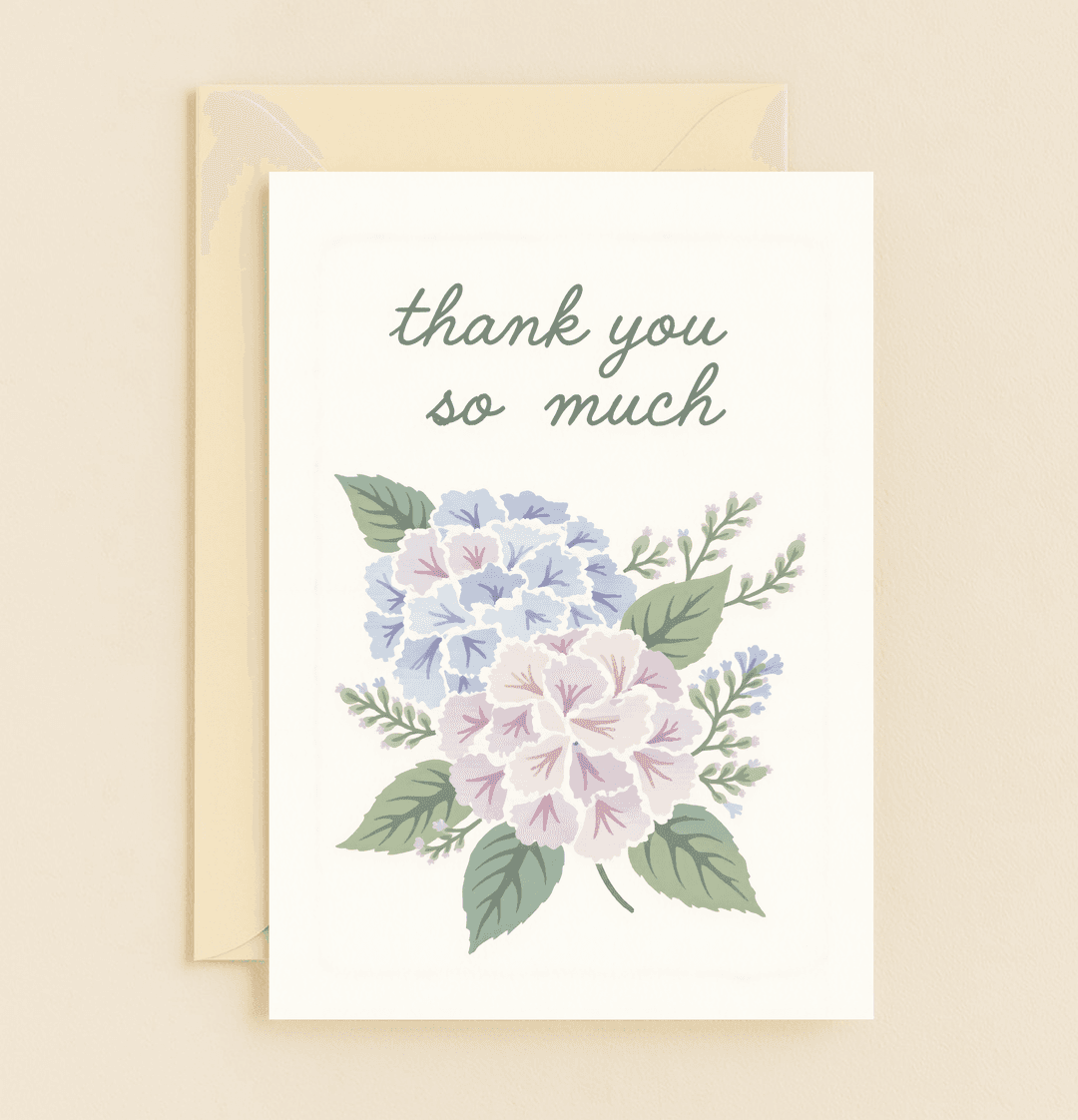 Express heartfelt thanks with this elegant card featuring a vibrant bouquet of blue and lavender hydrangeas against a crisp white background.